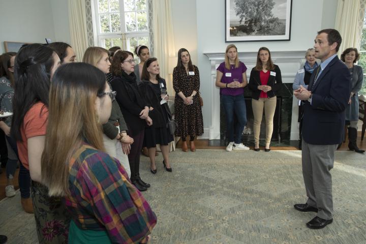 President Ryan welcomes students, faculty, and staff to the first edition of "Arts on the Hill," as they look on from the living room at Carr's Hill. 