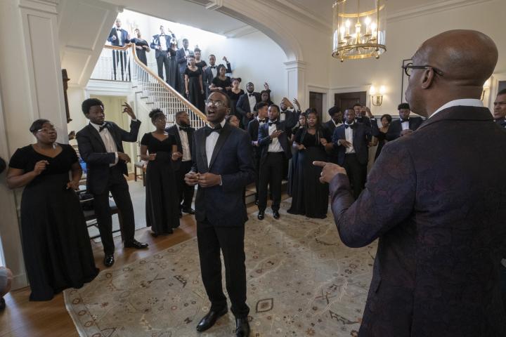 Singing an arrangement of "Smile," while enhancing the performance by simulating playing upright basses, The Aeolians of Oakwood University in Huntsville, Alabama filled the main foyer of Carr's Hill with their beautiful voices.