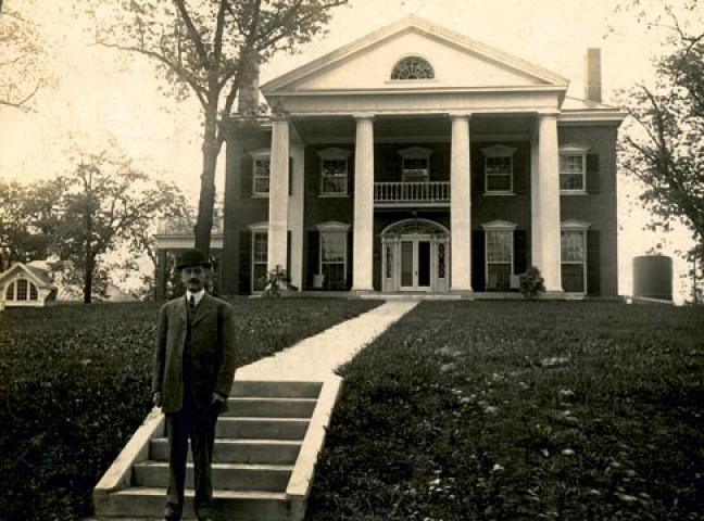 President Alderman sitting on the Carr’s Hill portico, circa 1917